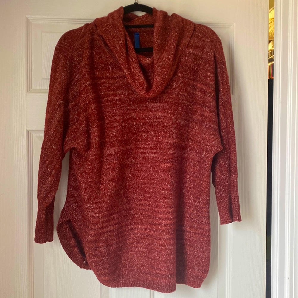 Cozy tunic length sweater with 3/4 length sleeves and flattering slots on sides